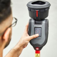 person using the testifire smoke detector test head unit 